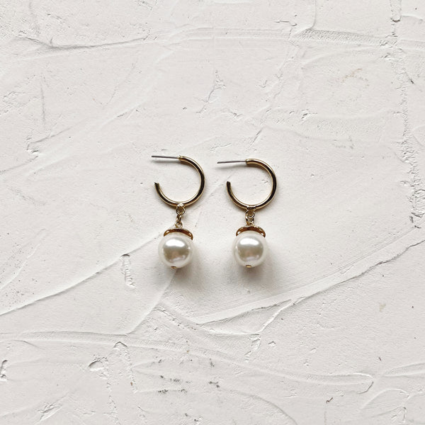 Thin gold hoop earrings with pearl